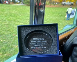 2022 HCCA Show 9556 Best In Show trophy displayed inside the 1934 Duesenberg sedan.