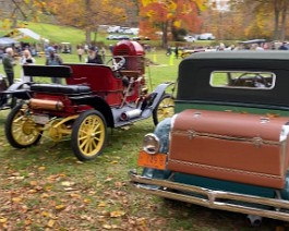 2022 HCCA Show 9604 1934 Duesenberg on the show field displayed next to an early Stanley steam car.