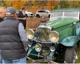 2022 HCCA Show 9609 Dick Shappy sitting next to his favorite car.