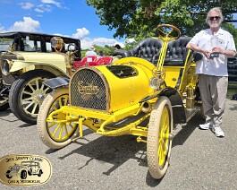 2026 Bay State Motor Festival 1905 Cameron 135417 Dick Shappy posing with the beautiful all crystal Best In Show award in front of his 1905 Cameron.