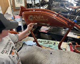 1917 Reading Standard Model T-E 12 HP Twin 2024-06-16 0566 Ryker checking the nickel plated shift gate on newly installed gas tank.